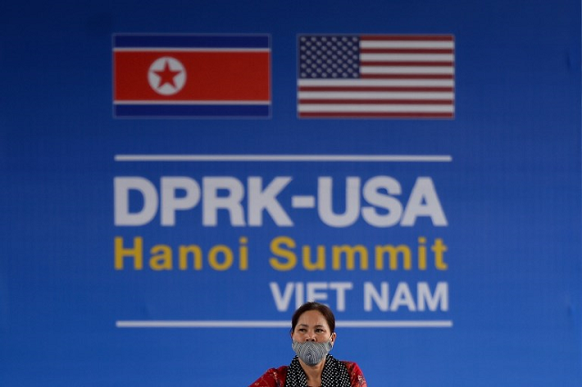 a vietnamese woman walks past a billboard for the upcoming second summit between us president donald trump and north korean leader kim jong un in hanoi on february 20 2019 photo afp a vietnamese woman walks past a billboard for the upcoming second summit between us president donald trump and north korean leader kim jong un in hanoi on february 20 2019 photo afp