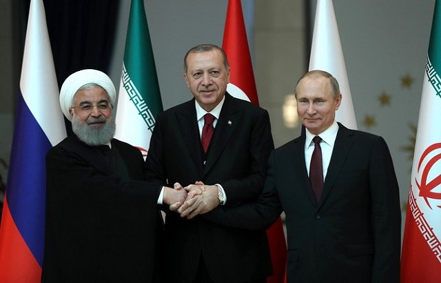 turkish president recep tayyip erdogan c russian president vladimir putin r and president of iran hassan rouhani l pose for a photo ahead of the turkey russia iran tripartite summit in ankara turkey on april 04 2018 photo afp turkish president recep tayyip erdogan c russian president vladimir putin r and president of iran hassan rouhani l pose for a photo ahead of the turkey russia iran tripartite summit in ankara turkey on april 04 2018 photo afp