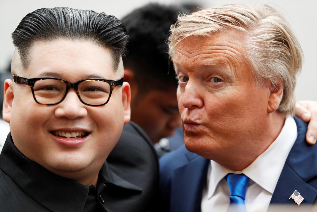 howard x an australian chinese impersonator of north korean leader kim jong un and russell white who is impersonating u s president donald trump pose for a photo outside the opera house ahead of the upcoming trump kim summit in hanoi vietnam photo reuters