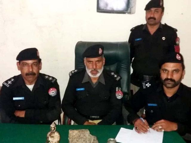 police show antiques seized from a house in haripur photo express police show antiques seized from a house in haripur photo express