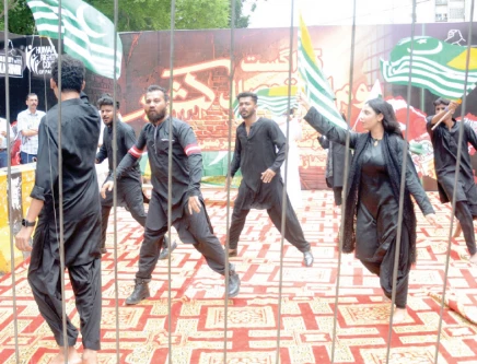 actors perform street theatre against oppression in iiojk outside the karachi press club to mark youm e istehsal on monday photo jalal qureshi express