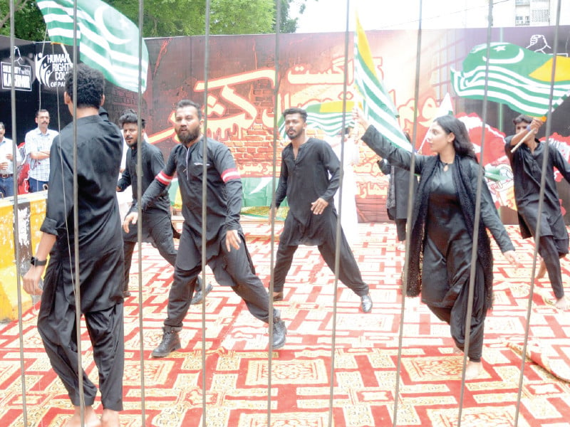 actors perform street theatre against oppression in iiojk outside the karachi press club to mark youm e istehsal on monday photo jalal qureshi express