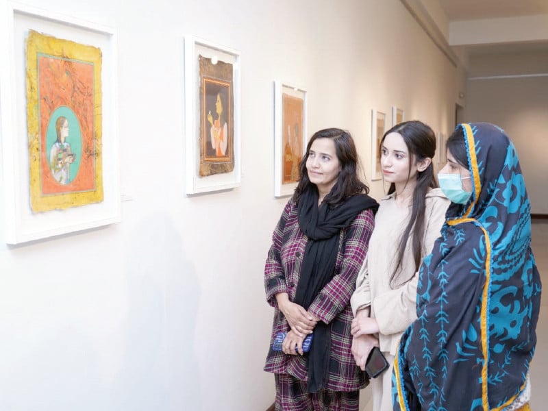 art enthusiasts explore the captivating paintings on display at the national art gallery islamabad photo express