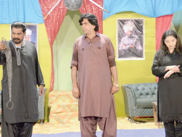 the nemesis looks at the chains removed from the female lead as the protagonist delivers the climax in a stage play featured at the sindh theatre festival larkana photo nni the nemesis looks at the chains removed from the female lead as the protagonist delivers the climax in a stage play featured at the sindh theatre festival larkana photo nni