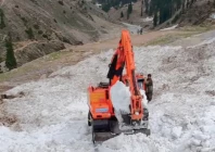 workers use machinery to cut through glaciers on the road to lake saiful malook to reopen it for traffic photo express