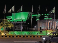 the parliament house has been illuminated with green lights to mark the first anniversary of marka e haq in the federal capital photo online