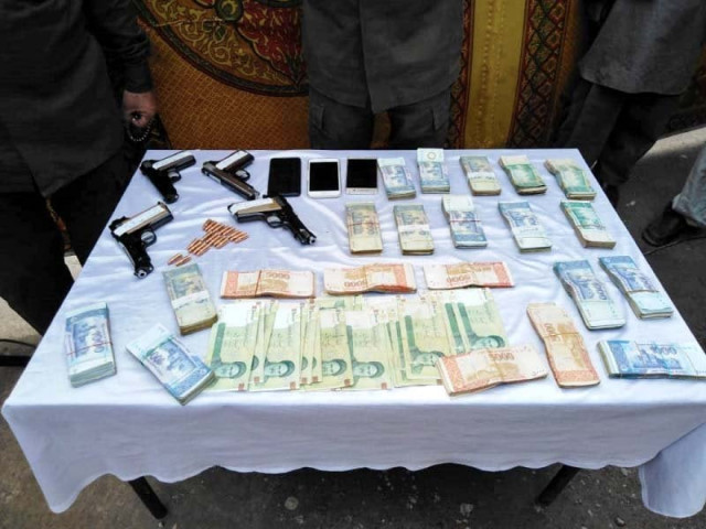 police display weapons and looted currency recovered from a gang of robbers photo express police display weapons and looted currency recovered from a gang of robbers photo express