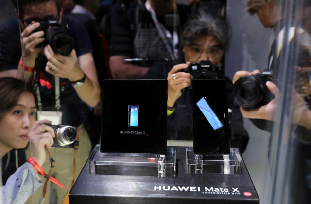 people take pictures of the new mate x smartphone ahead of the mobile world congress mwc 19 in barcelona spain february 24 2019 photo reuters