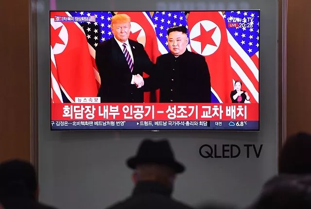a television screen shows a news broadcast of north korea 039 s leader kim jong un shaking hands with us president donald trump during their first meeting in hanoi photo afp a television screen shows a news broadcast of north korea 039 s leader kim jong un shaking hands with us president donald trump during their first meeting in hanoi photo afp