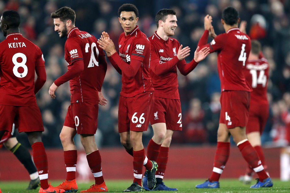 klopp s liverpool march on while guardiola s manchester city follow their chase for the title as spurs fall back photo afp