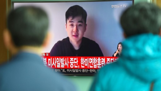 south koreans watch a tv news item showing video footage kim han sol a nephew of north korea 039 s leader kim jong un photo afp