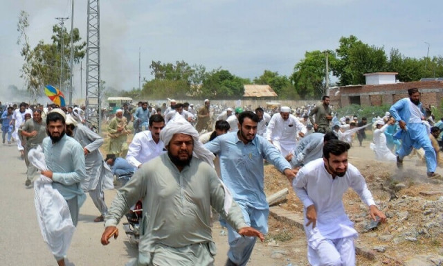 protesters run as gunfire broke out during a protest after the recent suicide attack by militants on an army enclave in bannu on july 19 photo afp protesters run as gunfire broke out during a protest after the recent suicide attack by militants on an army enclave in bannu on july 19 photo afp