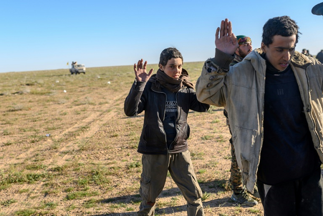 suspected islamic state group fighters have been detained by the us backed syrian democratic forces as they have left the final scrap of the quot caliphate quot photo afp