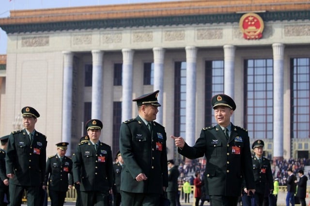 military delegates leave the great hall of the people after a meeting ahead of national people 039 s congress npc china 039 s annual session of parliament in beijing china photo reuters