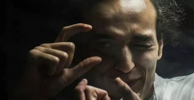 egyptian photographer mahmoud abu zeid known as shawkan gestures from inside a soundproof glass dock during his trial in cairo on august 9 2016 photo afp egyptian photographer mahmoud abu zeid known as shawkan gestures from inside a soundproof glass dock during his trial in cairo on august 9 2016 photo afp