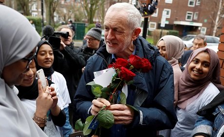 britain 039 s opposition labour party leader jeremy corbyn is greeted by young women and red roses during a visit to finsbury park mosque in london photo reuters