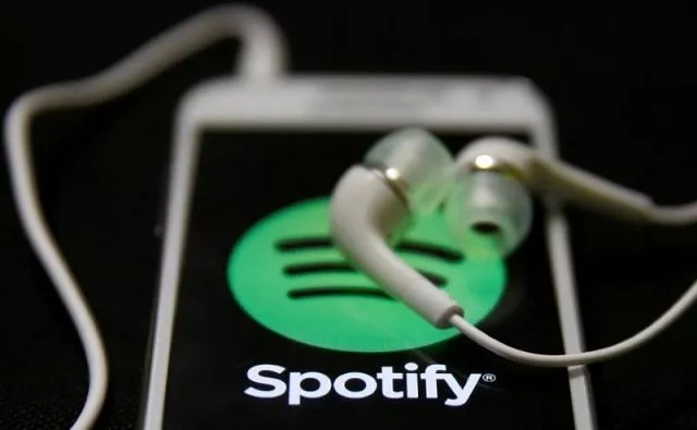 earphones are seen on top of a smart phone with a spotify logo on it in this february 20 2014 photo illustration photo reuters earphones are seen on top of a smart phone with a spotify logo on it in this february 20 2014 photo illustration photo reuters