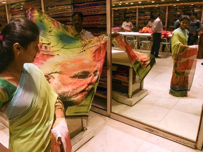 modi sari flies off shelves as india poll fever grows