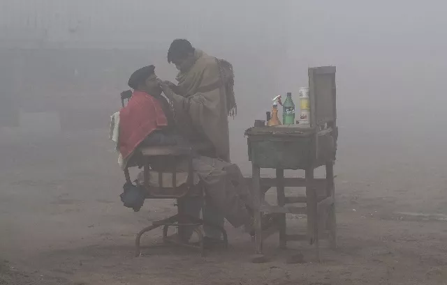 files in this file photo taken on january 24 2019 a pakistani barber shaves a customer alongside a road amid heavy fog and smog conditions in lahore photo afp files in this file photo taken on january 24 2019 a pakistani barber shaves a customer alongside a road amid heavy fog and smog conditions in lahore photo afp