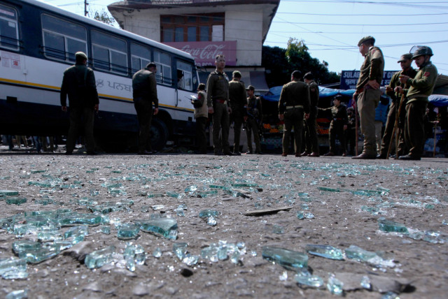 indian police inspect the site of a grenade blast at a bus station in jammu in iok photo afp indian police inspect the site of a grenade blast at a bus station in jammu in iok photo afp