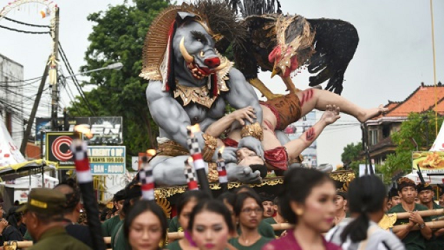 balinese people carry an ogoh ogoh effigy the day before the island falls silent for the quot day of silence quot photo afp