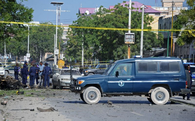 somali security forces gather at the site of a bomb blast near makka al mukarama road in the somali capital mogadishu on december 19 2015 photo afp somali security forces gather at the site of a bomb blast near makka al mukarama road in the somali capital mogadishu on december 19 2015 photo afp