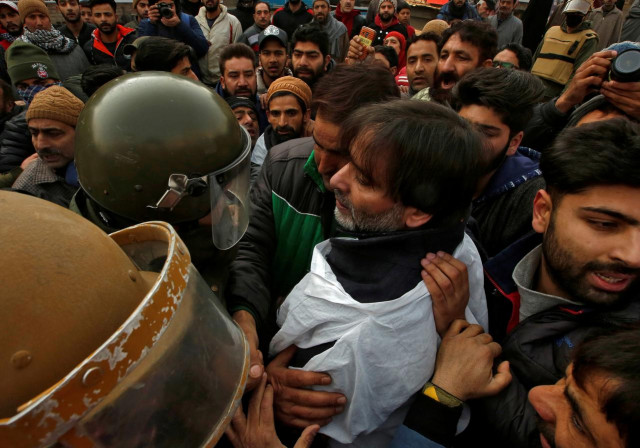 jammu kashmir liberation front chairman yasin malik is being taken into custody by indian police photo reuters file jammu kashmir liberation front chairman yasin malik is being taken into custody by indian police photo reuters file