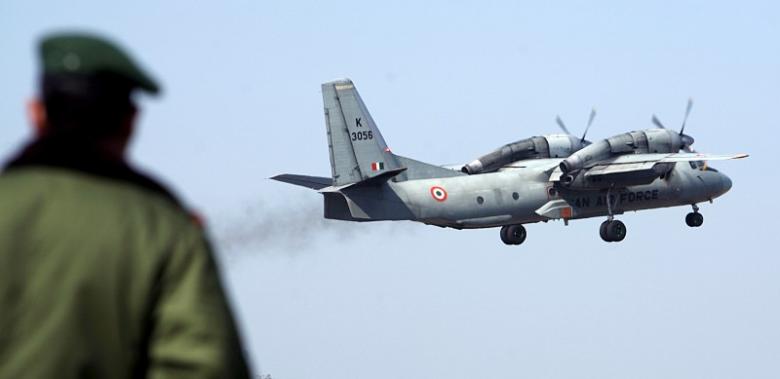 a soldier stands guard as an indian air force an 32 transport aircraft carrying security personnel takes off from the technical airport in jammu february 9 2008 photo reuters