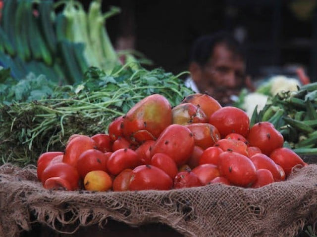 trucks loaded with indian tomatoes and garlic have begun to reach the vegetable markets in rawalpindi and lahore photo file