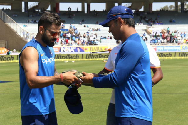 mahendra singh dhoni presents camouflage cap to indian captain virat kohli photo bcci mahendra singh dhoni presents camouflage cap to indian captain virat kohli photo bcci