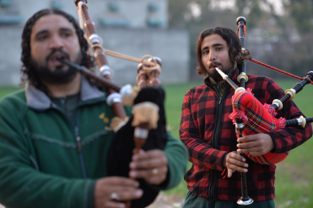 a pakistani musical band performs with bagpipes photo afp