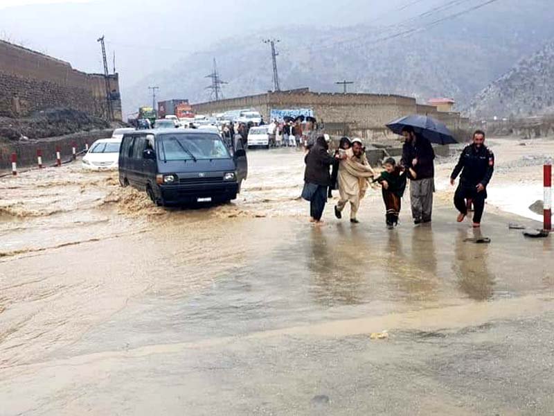 a snow woman in parachinar and view of peshawar kohat road after heavy rain photos express