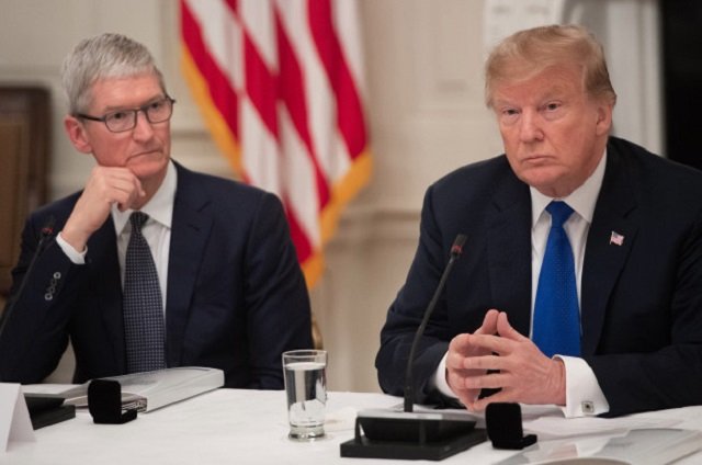 apple ceo tim cook l listens to us president donald trump during an american technology council roundtable at the white house in washington dc on june 19 2017 photo afp