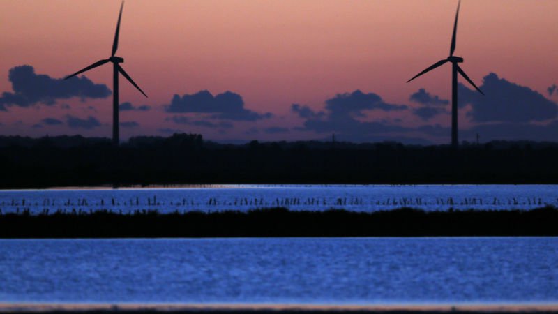 power generating windmill turbines are seen at sunset photo reuters