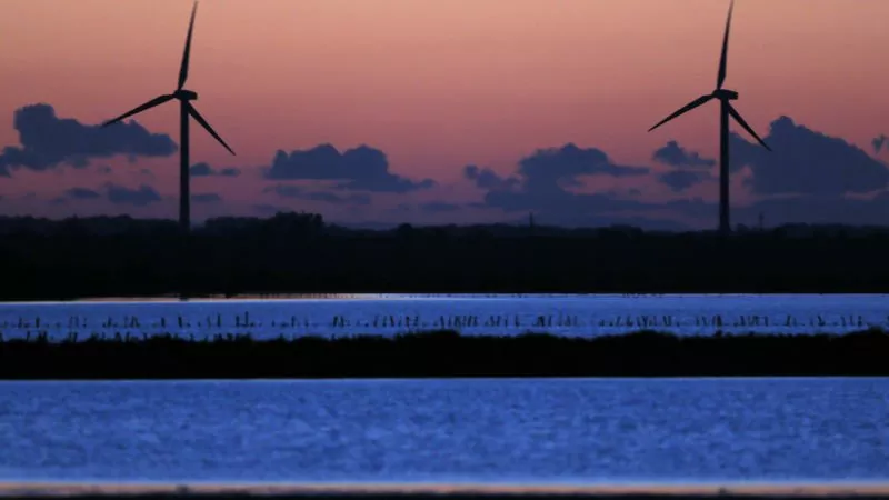 power generating windmill turbines are seen at sunset photo reuters power generating windmill turbines are seen at sunset photo reuters