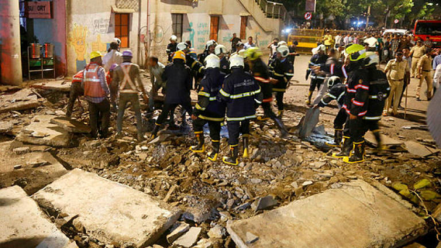 rescue workers and fire brigade personnel remove debris at the site of a footbridge after its collapse outside the chhatrapati shivaji maharaj terminus railway complex in mumbai photo afp rescue workers and fire brigade personnel remove debris at the site of a footbridge after its collapse outside the chhatrapati shivaji maharaj terminus railway complex in mumbai photo afp