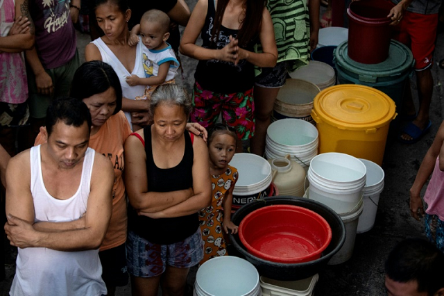 residents of manila queue to recieve water distributed as the philippine capital endures a prolonged drought photo afp