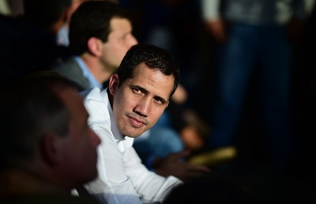 topshot   venezuelan opposition leader and self proclaimed interim president juan guaido attends a meeting with local leaders in caracas on march 14 2019   venezuelans resumed work thursday after a weeklong hiatus forced by an unprecedented nationwide blackout photo afp