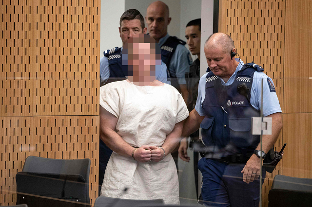 brenton tarrant the man charged in relation to the christchurch massacre is lead into the dock for his appearance in the christchurch district court photo afp