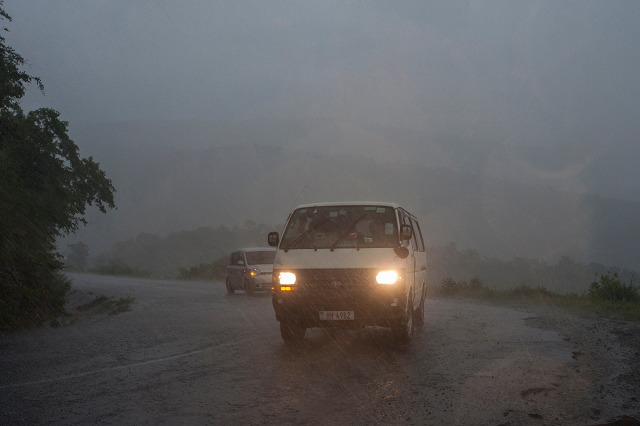 picture shows vehicules as rain which is believed to be the beginning of tropical cyclone idai coming from central mozambique