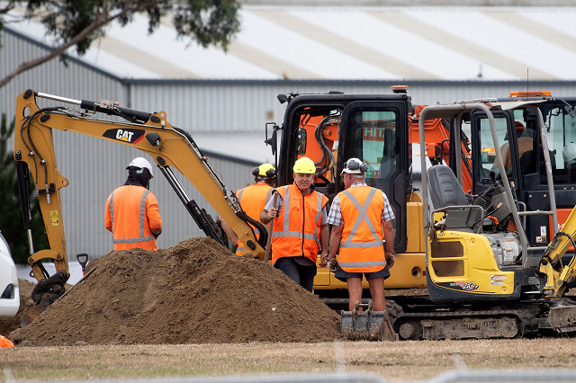 workers dig grave sites at a cemetery in christchurch on march 17 2019 two days after a shooting incident at two mosques in the city photo afp