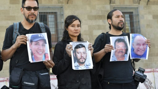 journalists hold up photos of slain colleagues at a rally in mexico city in june 2018 photo afp journalists hold up photos of slain colleagues at a rally in mexico city in june 2018 photo afp