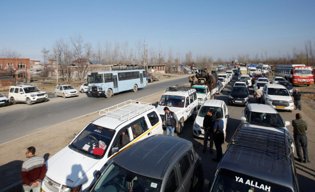 traffic is stopped as the indian central reserve police force crpf convoy moves along a national highway in qazigund march 18 2019 photo reuters traffic is stopped as the indian central reserve police force crpf convoy moves along a national highway in qazigund march 18 2019 photo reuters