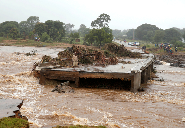 a man looks at a washed away bridge along umvumvu river following cyclone idai in chimanimani zimbabwe photo reuters