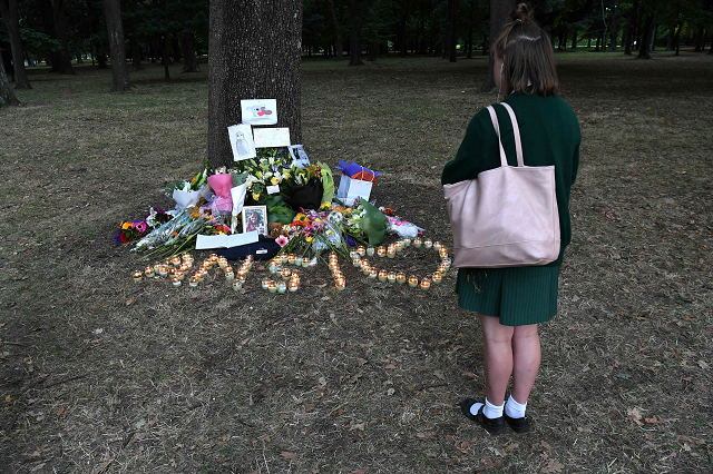 a student pays respect at a memorial site for the victims of mosque attacks in christchurch photo afp a student pays respect at a memorial site for the victims of mosque attacks in christchurch photo afp