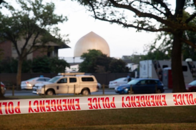 police secure the area with tape across the road from the dean avenue mosque on march 17 2019 in christchurch new zealand photo afp