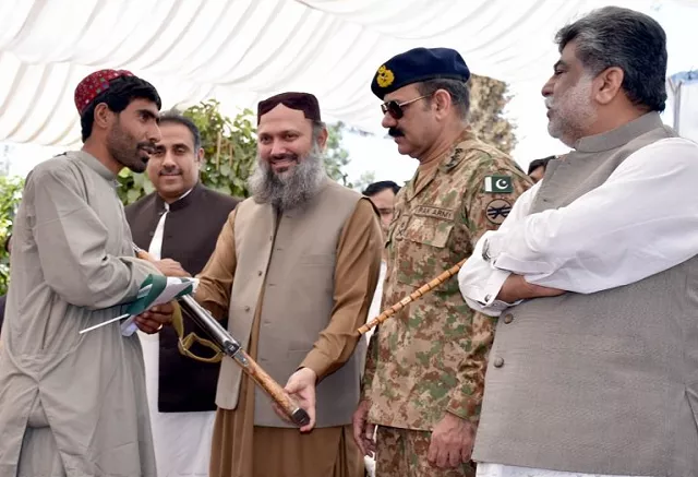 a ferrari hands over his weapon to chief minister jam kamal khan in the garden of the balochistan assembly photo mohammad zafar express a ferrari hands over his weapon to chief minister jam kamal khan in the garden of the balochistan assembly photo mohammad zafar express