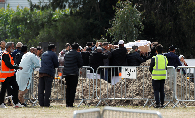 the body of a victim of the mosque attacks is carried during the burial ceremony at the memorial park cemetery in christchurch photo reuters