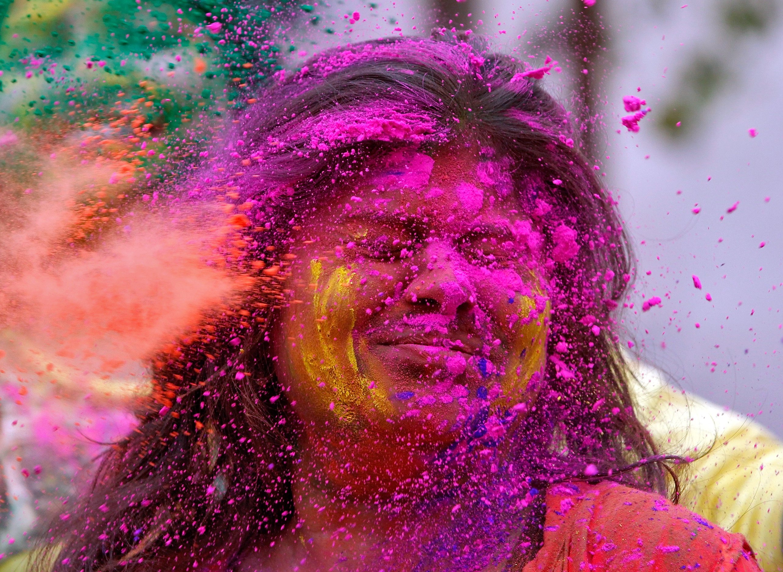 a college student reacts as coloured powder is thrown into her face agartala india photo reuters