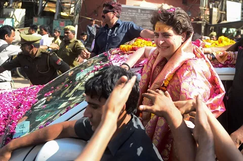 priyanka gandhi vadra congress general secretary gestures to supporters as she returns after visit kashi vishwanath temple allahabad to varanasi photo afp priyanka gandhi vadra congress general secretary gestures to supporters as she returns after visit kashi vishwanath temple allahabad to varanasi photo afp